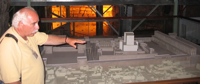 Guide Ronnie Cohen explains scale model of Temples