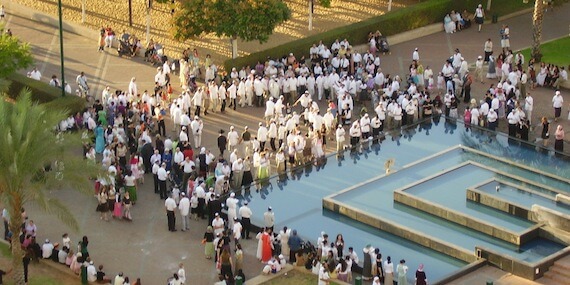 Participating in tashlikh on Rosh Hashanah.