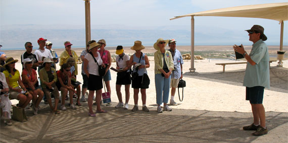 Teaching about the scrolls' significance in front of Cave 4